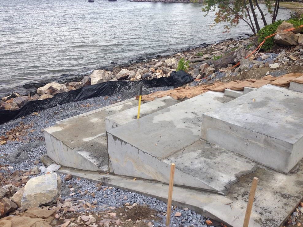 Massive concrete base will provide base for stone steps and seating blocks at Pause Place 2.