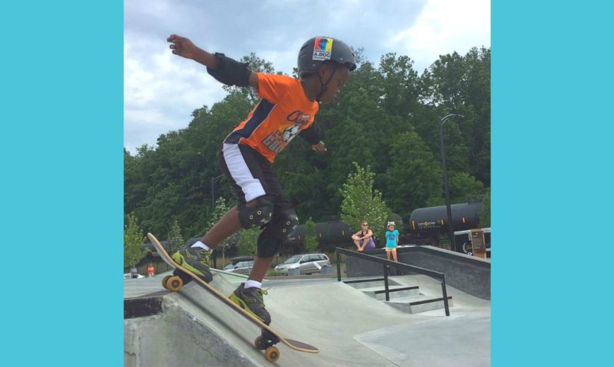 Photo of child skateboarding with text: Sign up for Summer!
