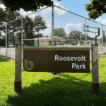 Photo of Roosevelt Park sign in the sunshine